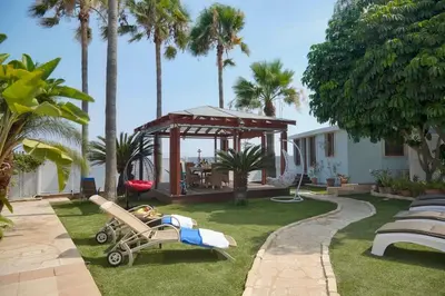 a backyard with a playground and a gazebo at Limassol Beachfront Holiday Villa in Limassol