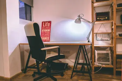 a desk with a black chair and a lamp at Cozy Flat City Center in Nicosia