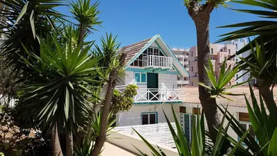a house with a balcony on top of a building at ZORBAS Sea View No 4 in Larnaka