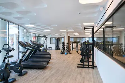 a gym with treadmills and elliptical machines at Sunrise Beach Hotel in Protaras