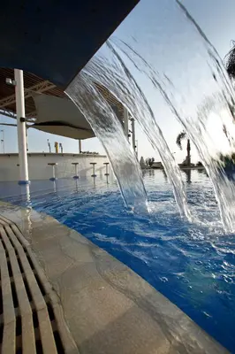 a water fountain in a swimming pool at Sunrise Oasis Hotel & Waterpark in Protaras