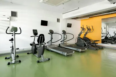 a gym with several exercise bikes in a room at UC Hall Residence in Nicosia