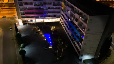 an overhead view of a building with blue lights at UC Hall Residence in Nicosia