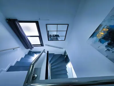 a staircase in a building with a window at 3 Bedroom Villa, private pool, hot tub in Protaras