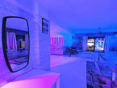 a room with a mirror and a living room at 3 Bedroom Villa, private pool, hot tub in Protaras