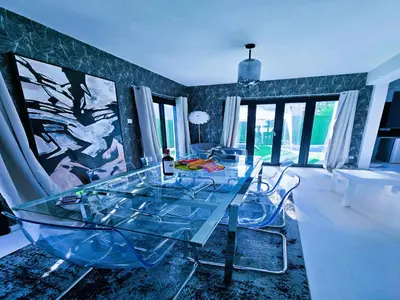 a dining room with a glass table and chairs at 3 Bedroom Villa, private pool, hot tub in Protaras