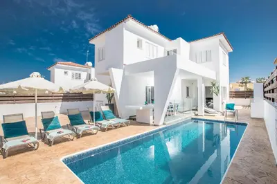a villa with a swimming pool and a house at Marimar villa in Protaras