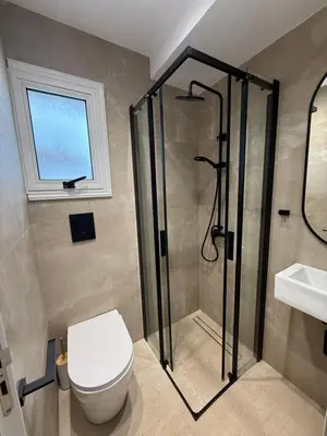a bathroom with a shower and a toilet and a sink at Marimar villa in Protaras