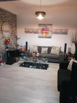 a living room with a couch and a glass table at Andros Residence in Limassol