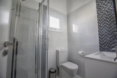 a bathroom with a toilet and a sink and a shower at Konnos Hight Villa in Protaras