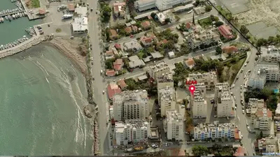 an aerial view of a city next to the water at LCA4 flat for you apartment in Larnaka