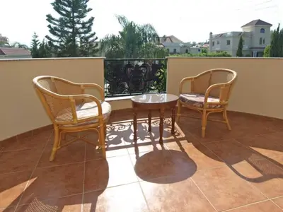 two chairs and a table on a balcony at Patatas Villa in Limassol