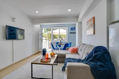 a living room with a couch and a table at Atlantis Apartments 50m from Makenzy seafront in Larnaka