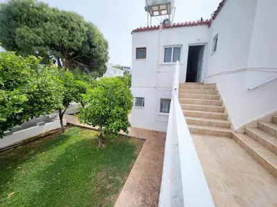 a view of a building with stairs and a yard at Florence Hotel Apartments in Ayia Napa