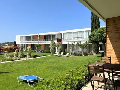 a house with a lawn with a blue item on it at Art by PraXis in Governors Beach