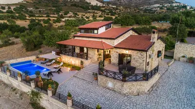 an aerial view of a house with a swimming pool at Lefkara Villa in Kato Lefkara