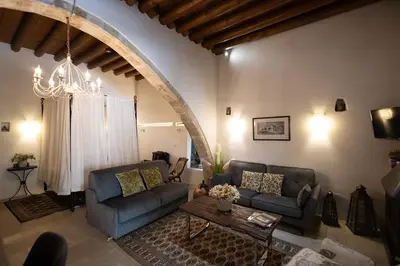 a living room with a couch and a table at Apanemia Inn Studio in Lofou