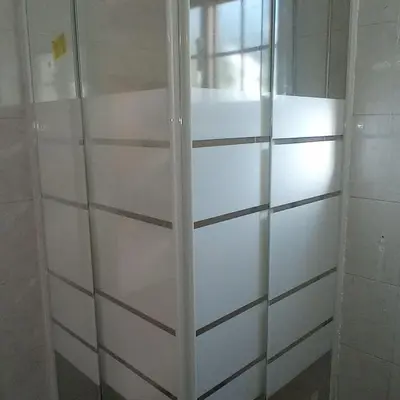 a white closet with glass doors in a room at Kampi Double Storey House in the Village in Nicosia