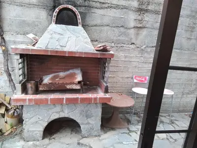 an outdoor brick oven with austed at Kampi Double Storey House in the Village in Nicosia