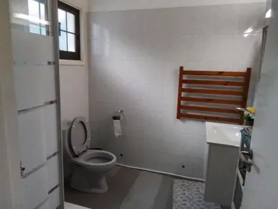 a bathroom with a toilet and a sink at Kampi Double Storey House in the Village in Nicosia