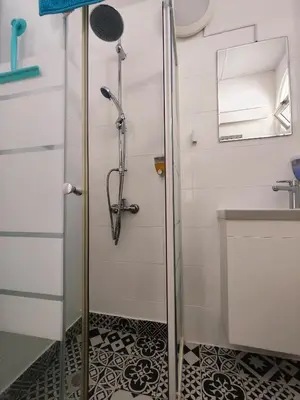a bathroom with a shower and a sink at Elena Holiday Apartment in Larnaka