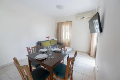 a dining room with a table and chairs at La Casa Di Napa Apartments in Ayia Napa