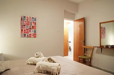 a bedroom with a bed with towels on it at Maria Court 2, Apt 32 in Larnaka