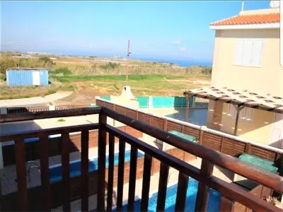a balcony of a house with a swimming pool at Villa Jade in Paralimni