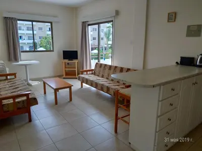 a living room with a couch and a table at Maricosta Apartments in Protaras