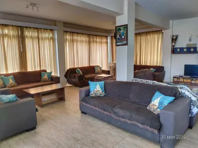 a large living room with couches and a table at Maricosta Apartments in Protaras