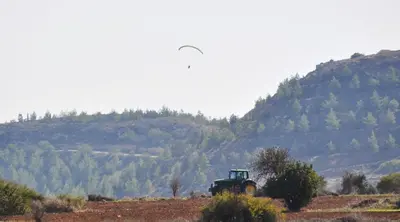 an old truck in a field with a mountain at Athieno - Αθηαινώ in Athienou