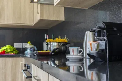a kitchen with a counter top with a coffee maker at Protaras Villa Araella in Ayia Napa