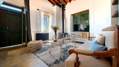 a living room with a couch and a table at Oinou Strata - Adults Only in Vouni