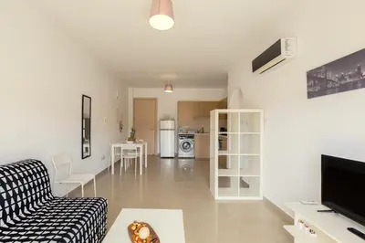 a living room with a couch and a table at Oceania Bay Village in Pyla