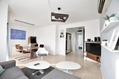 a living room with a couch and a table at Glabur Stays - The Cozy 2 BDR - Nicosia City, Free Parking & Wifi, Welcomes You!!! in Nicosia
