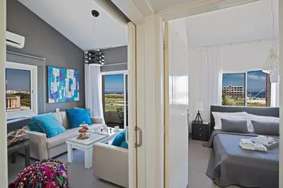 a living room with a bed and a couch at Nicholas Seaview Apartments in Protaras