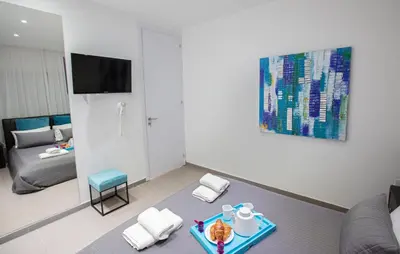 a living room with a couch and a table at Nicholas Seaview Apartments in Protaras
