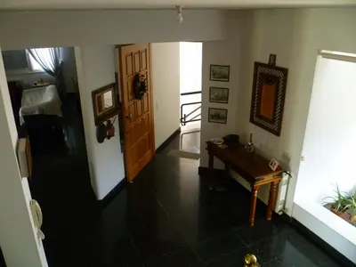 a hallway with a door and a table in a room at Private deluxe room with balcony at Datacom building in Nicosia