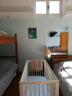 a room with a crib in a bedroom at Swallows Nest in Larnaka