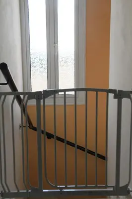 a stair railing in a room with a window at Maricosta Villas in Protaras