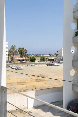 a view from the balcony of a parking lot at Blue Dawn Center Flat in Larnaka