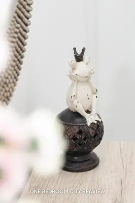 a figurine of a unicorn sitting on a black vase at Lazuli Seaview Apartments 2Bdr in Larnaka