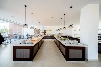 a large kitchen with a buffet line in a restaurant at Eleana Hotel in Ayia Napa