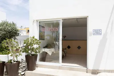 a window of a restaurant with a table in it at Christothea Apartments in Ayia Napa