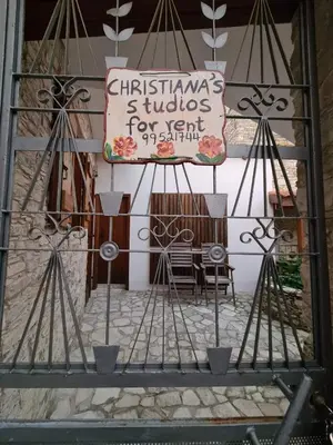 a sign on the side of a building at Christiana's stone studios in Pano Lefkara