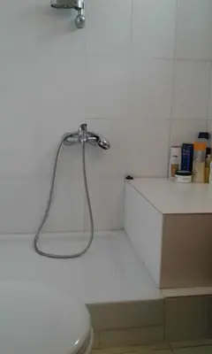 a bathroom with a white toilet and a shower at Christiana's stone studios in Pano Lefkara