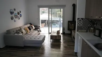 a living room with a couch and a table at Evmelia Kakopetria Suites in Kakopetria