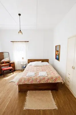 a bedroom with a large bed in a white room at Forest Park Villa in Lemithou