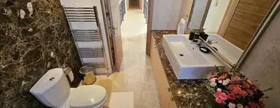 a bathroom with a white toilet and a sink at SeaView 6 Bedroom Villa & Private Pool in Limassol