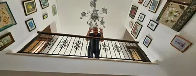 a person standing on a stair railing at SeaView 6 Bedroom Villa & Private Pool in Limassol